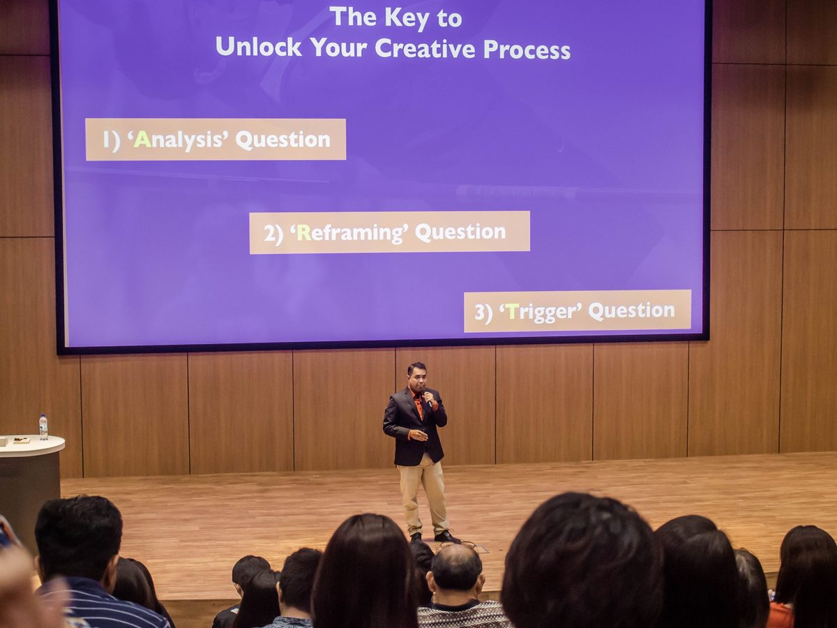 Hazriq Idrus speaking at the World Success Summit